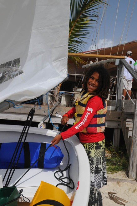 Motali Sofer-Greer, from St. John’s Kids and the Sea program, readies his boat to sail in the Green Fleet. © Dean Barnes