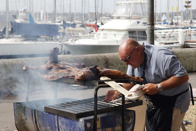Master varnisher, Julio from Argentina, sets his culinary skills to the celebratory BBQ. - Rolex Sydney Hobart Yacht Race ©  Alex McKinnon Photography http://www.alexmckinnonphotography.com