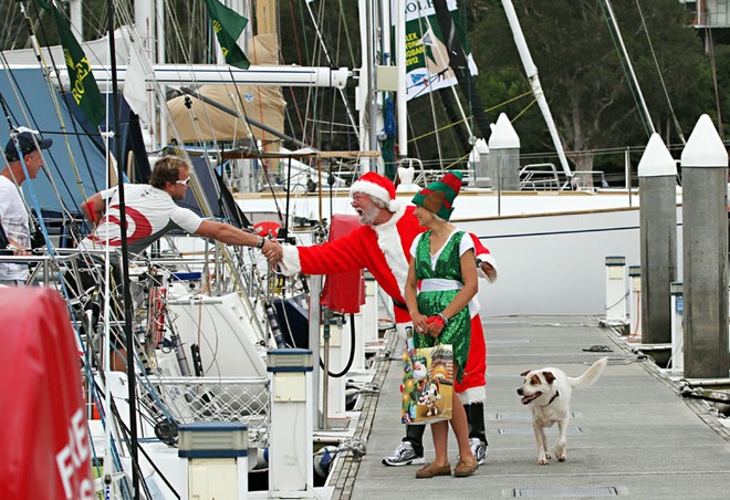 Santa stopped to greet all and sundry with the help of Elf, Alex, and a wonderfully enthusiastic pooch, as well. - Rolex Sydney Hobart Yacht Race ©  John Curnow