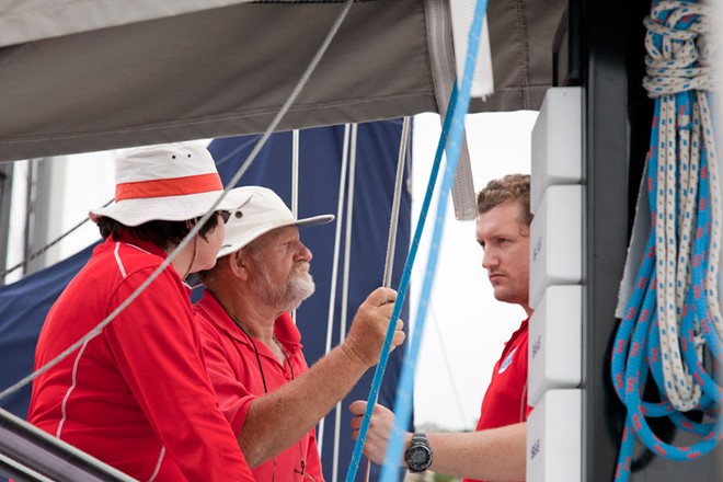 David Pescud of Sailors with Disabilities discusses the programme with crew members - Rolex Sydney Hobart Yacht Race ©  Alex McKinnon Photography http://www.alexmckinnonphotography.com