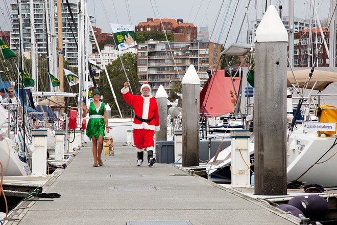 Santa and Elf come striding down the dock at the CYCA. - Rolex Sydney Hobart Yacht Race ©  Alex McKinnon Photography http://www.alexmckinnonphotography.com