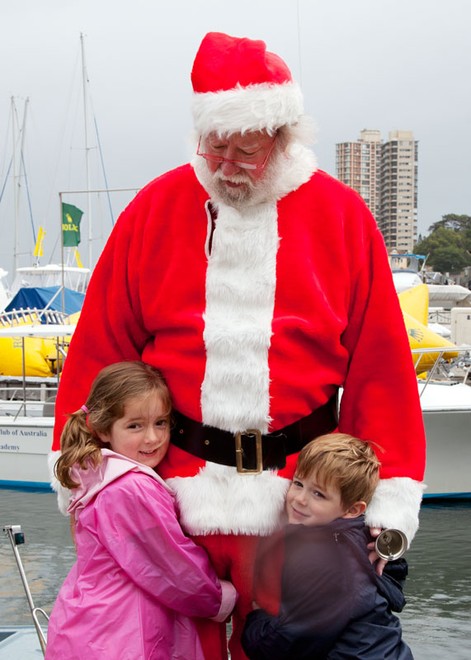 Santa was flocked to by all the kids and a few adults, too. - Rolex Sydney Hobart Yacht Race ©  Alex McKinnon Photography http://www.alexmckinnonphotography.com