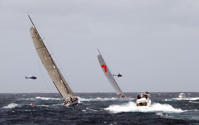Wild Oats ahead of Ragamuffin Loyal after leaving the Heads - Rolex Sydney to Hobart ©  Alex McKinnon Photography http://www.alexmckinnonphotography.com