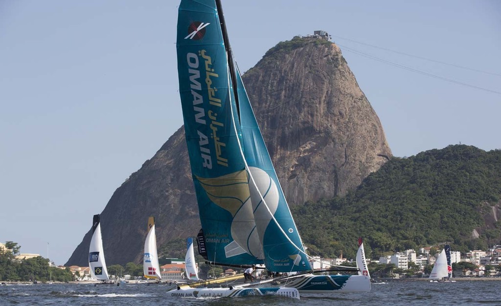 Oman Air leads the fleet downwind crossing in front of iconic Sugarloaf mountain in Rio - 2012 Extreme Sailing Series - Act 8 Rio photo copyright Lloyd Images http://lloydimagesgallery.photoshelter.com/ taken at  and featuring the  class