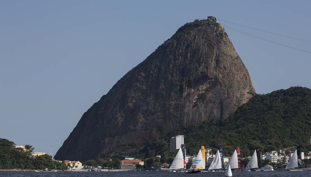 The fleet of Extreme 40s sails in front of iconic Sugarloaf mountain in Rio de Janeiro, Brazil - 2012 Extreme Sailing Series - Act 8 Rio © Lloyd Images http://lloydimagesgallery.photoshelter.com/