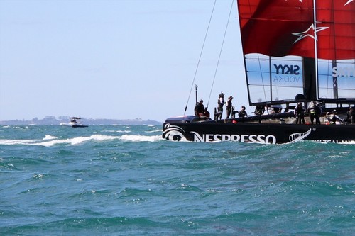 A spy boat watches Emirates Team NZ AC72 on her final day of sailing on December 12, 2012  © Richard Gladwell www.photosport.co.nz