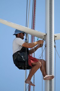 Working away up the mast on Brindabella. - Rolex Sydney Hobart Yacht Race photo copyright  Alex McKinnon Photography http://www.alexmckinnonphotography.com taken at  and featuring the  class