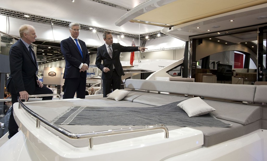 Michael Fallon the Minister for Business  and Howard Pridding the CEO of the British Marine talk to Alastair Schofield, the CEO of Fairline Boats at the Tullett Prebon London Boat Show, ExCeL, London. photo copyright onEdition http://www.onEdition.com taken at  and featuring the  class