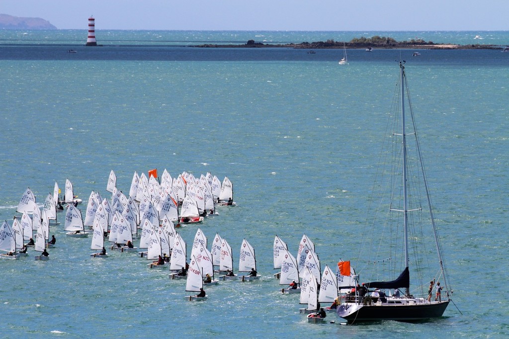 The start, or a second or so afterwards (the General Recall flag is not yet flying) - 2013 Auckland Optimist Championships, Wakatere Boating Club photo copyright Richard Gladwell www.photosport.co.nz taken at  and featuring the  class