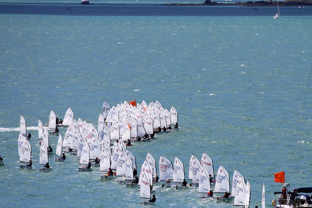 6 secs before the start - the bulk of the fleet has crossed to leeward, with the middle of the fleet holding well back - 2013 Auckland Optimist Championships, Wakatere Boating Club © Richard Gladwell www.photosport.co.nz