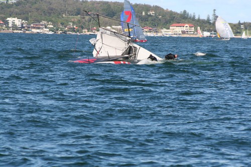 Yamaha seconds after nose diving, which sent the crew around the forestay, during Heat 2. © Lyn Holland