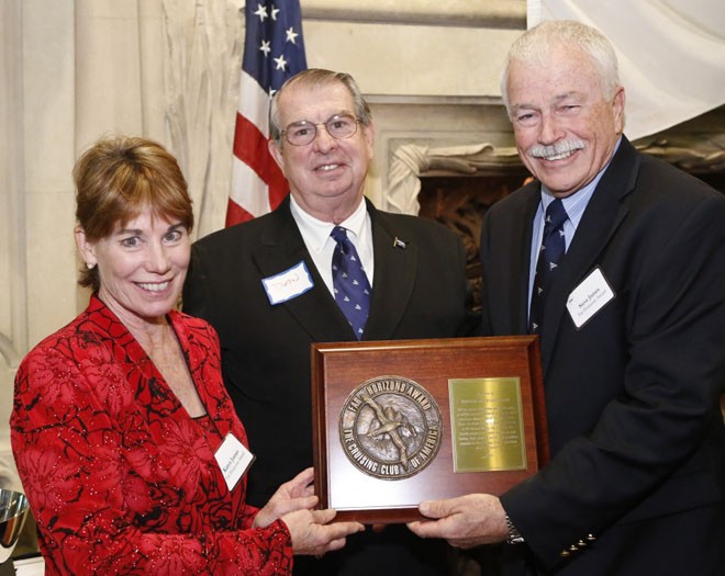 Karyn (left) and Stephen (right) James accept the 2012 Far Horizons Award from Cruising Club of America Commodore Daniel P. Dyer, III (center) for a commendable ten years and 38,000 miles of cruising.  © Dan Nerney 