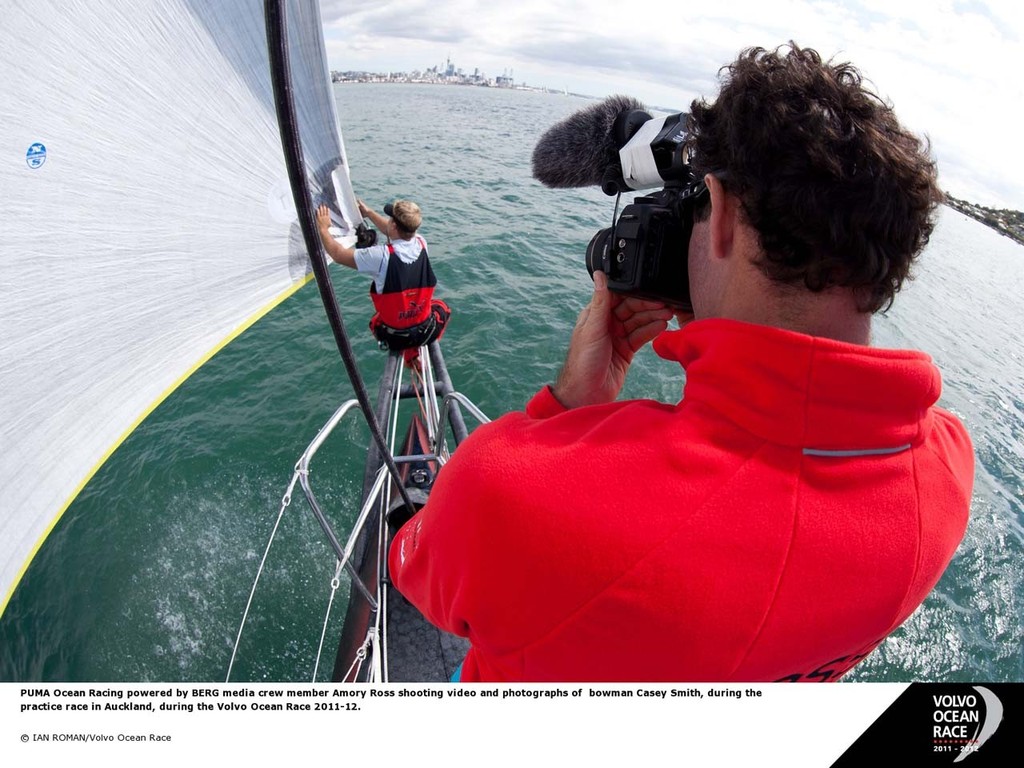 PUMA Ocean Racig powered by BERG media crew member Amory Ross shooting video and photographs of bowman Casey Smith, during the practice race in Auckland during the Volvo Ocean Race 2011-12 photo copyright Ian Roman/Volvo Ocean Race http://www.volvooceanrace.com taken at  and featuring the  class