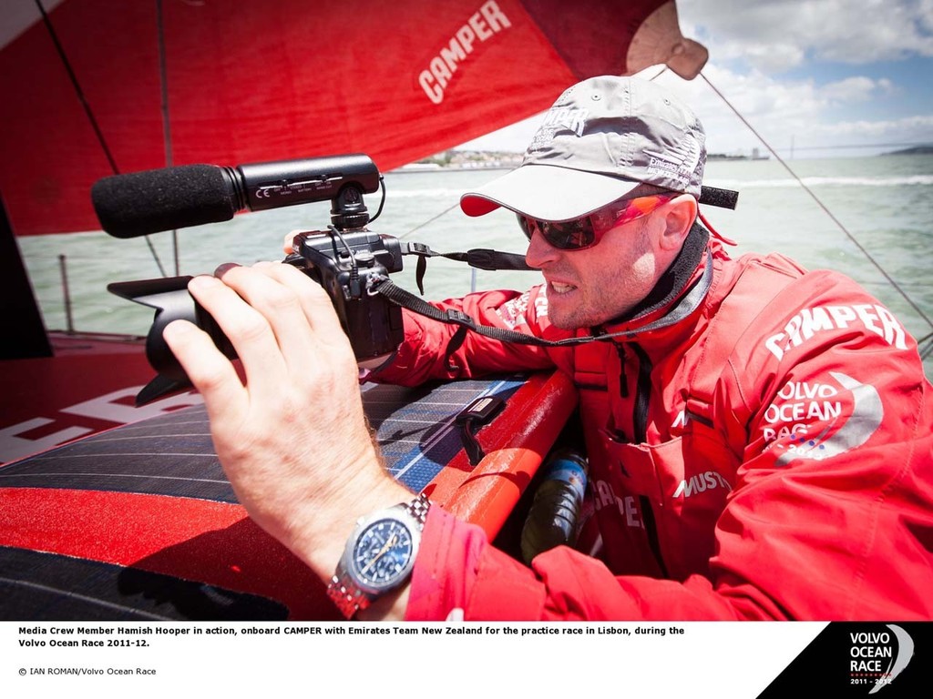 Media Crew Member Hamish Hooper in action, onboard Camper with Emirates Team New Zealand for the practice race in Lisbon, during the Volvo Ocean Race 2011-12 photo copyright Ian Roman/Volvo Ocean Race http://www.volvooceanrace.com taken at  and featuring the  class
