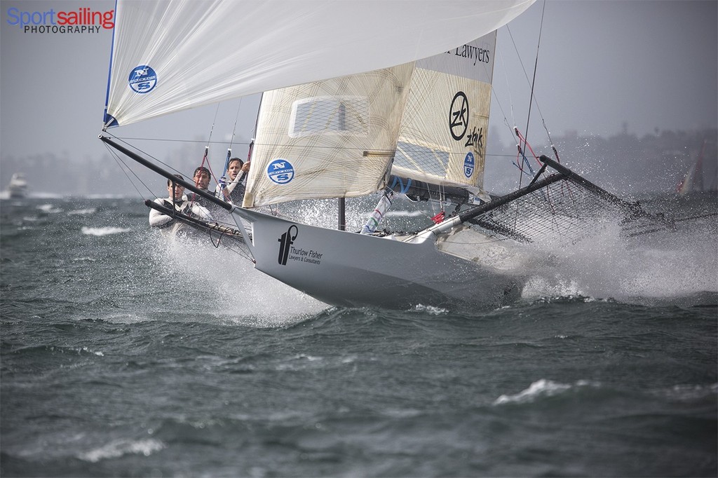 Another top Zhik crew, Thurlow Fisher Lawyers put on the action for the final race of the JJ Giltinan 2013 - 18ft Skiff JJ Giltinan Championships2013 - Race 7 photo copyright Beth Morley - Sport Sailing Photography http://www.sportsailingphotography.com taken at  and featuring the  class