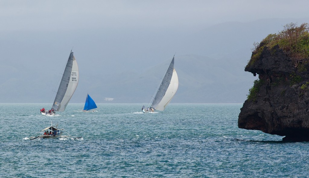 Boracay Cup Regatta 2013. Rounding the top end of Boracay. HiFi and Antipodes. © Guy Nowell http://www.guynowell.com
