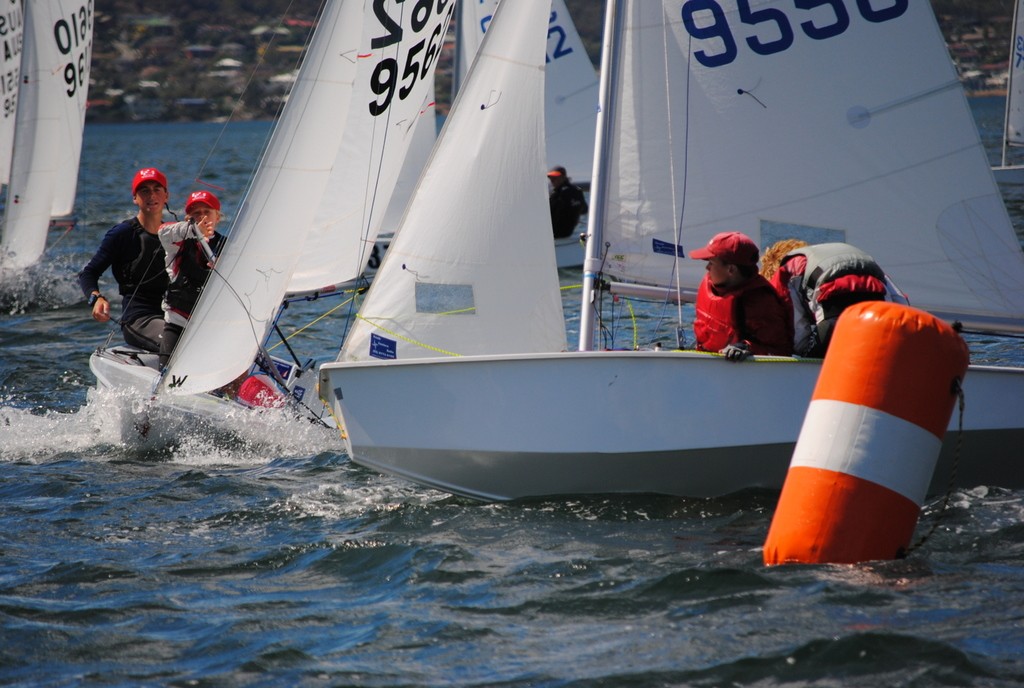 Close encounter between two Cadets at the windward mark at Crown Series Bellerive Regatta 2013 © Peter Campbell