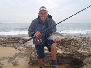 Alan Perry with a luderick that was caught while fishing the wash behind him. This was at the top of the tide. photo copyright Gary Brown taken at  and featuring the  class