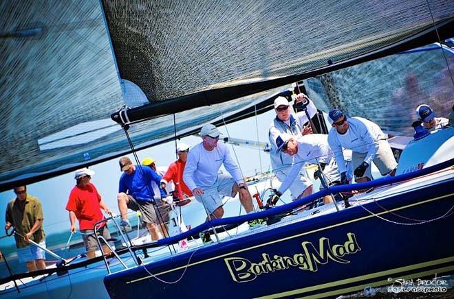 Skipper Jim Richardson (holding tiller) and the crew aboard Barking Mad posted results of second and third in two races on Friday and now hold the overall lead in the regatta © Sara Proctor http://www.sailfastphotography.com
