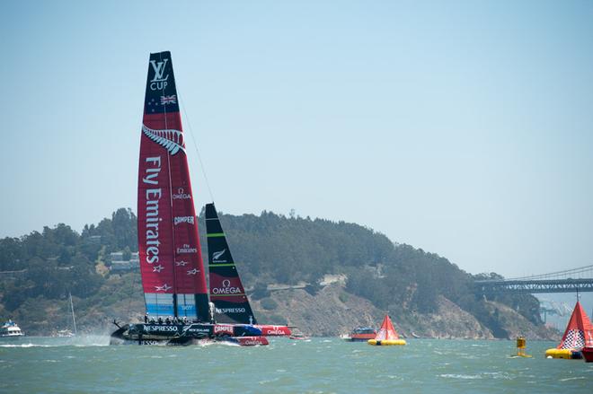 Emirates Team New Zealand cross the finish line for the first point after Luna Rossa elected not to sail the first race of the Louis Vuitton Cup 2013.  © Chris Cameron/ETNZ http://www.chriscameron.co.nz