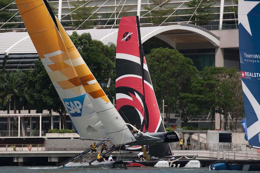 SAP Extreme Sailing Team fly a hull in Marina Bay, Singapore photo copyright Lloyd Images http://lloydimagesgallery.photoshelter.com/ taken at  and featuring the  class