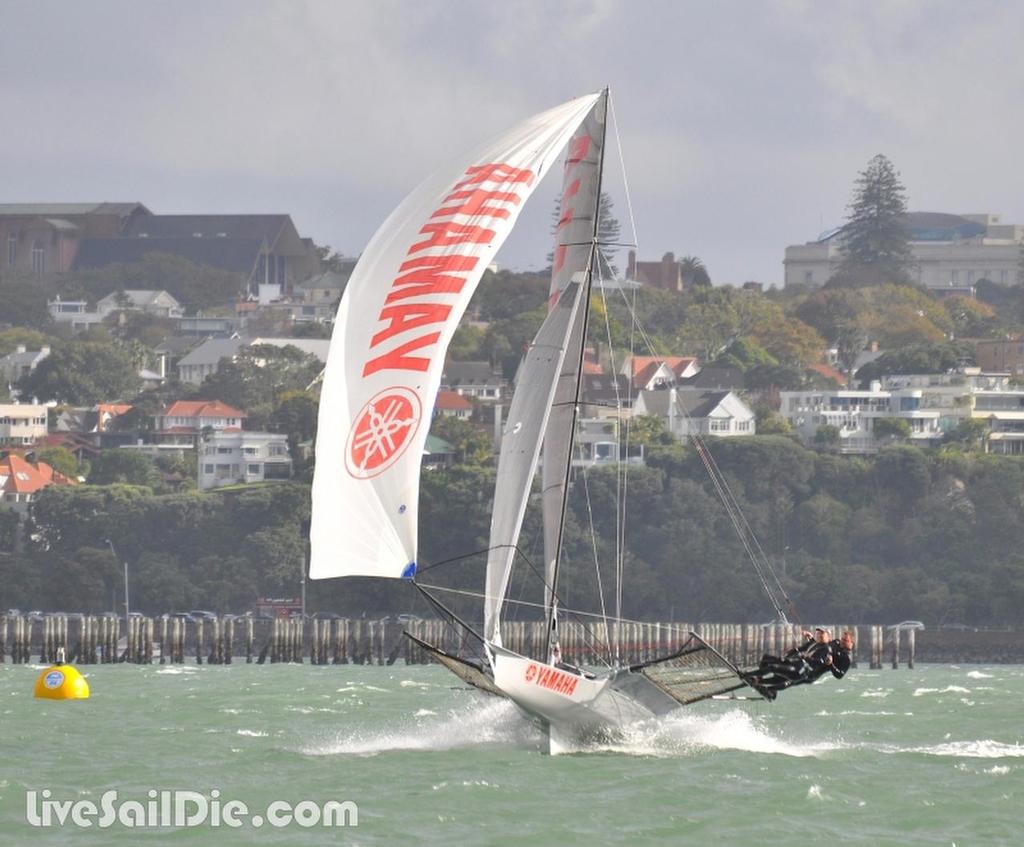Yamaha-White in full flight down the seawall off Okahu Bay on Day 1 of the ANZAC 18ft Skiff Championships photo copyright Brad Davies-LiveSailDie.com http://www.livesaildie.com taken at  and featuring the  class