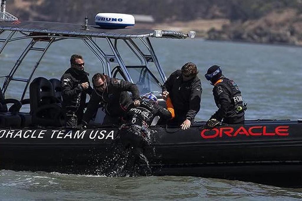 Expanded image - Jimmy Spithill being retrieved from San Francisco Bay photo copyright Oracle Team USA http://www.oracleteamusa.com taken at  and featuring the  class