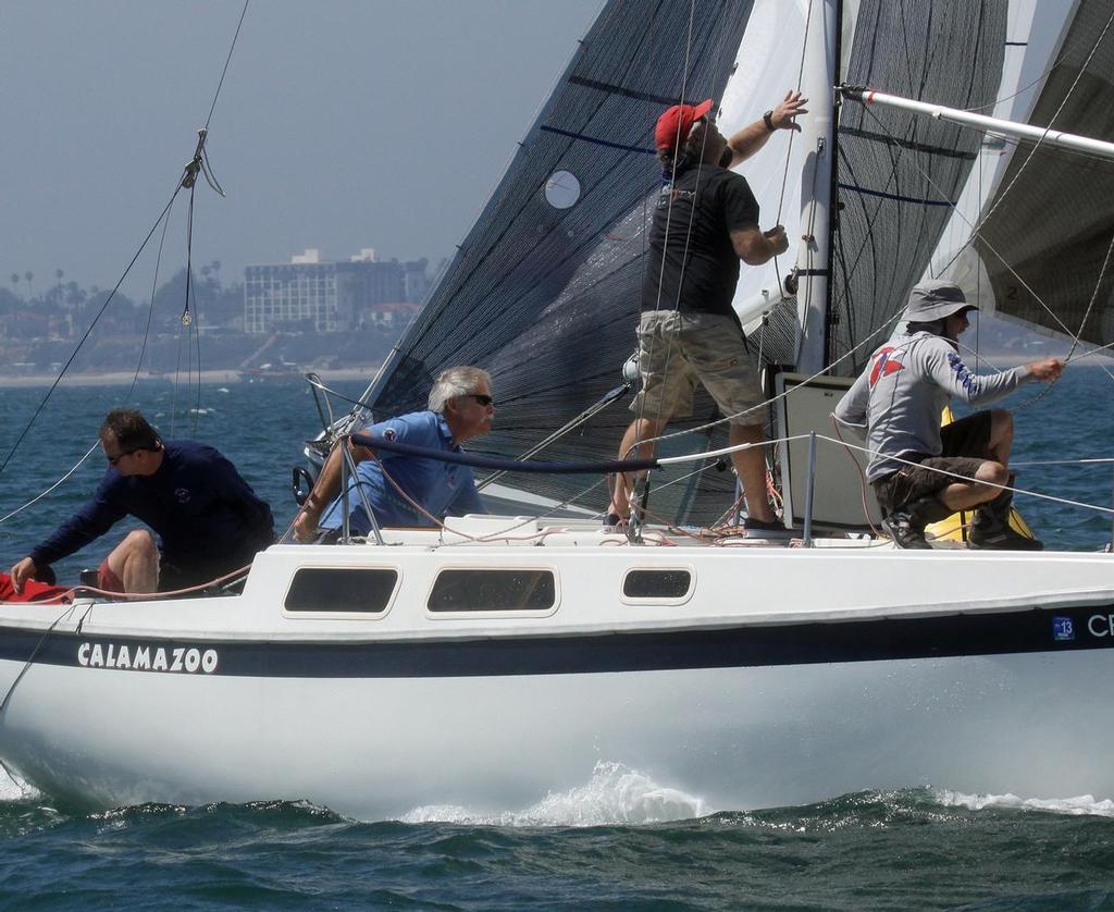 Scott Holcomb (blue shirt at helm) and his team led enough times around the race marks to win the 2013 Walt Elliott Harbor Challenge regatta. © Rick Roberts 