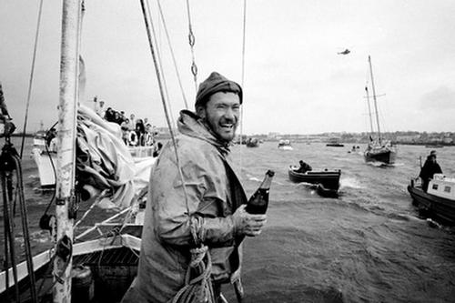 Circa 22nd April 1969: Robin Knox-Johnston celebrates aboard his 32ft yacht SUHAILI off Falmouth, England after becoming the first man to sail solo non-stop around the globe. Knox-Johnston was the sole finisher in the Sunday Times Golden Globe solo round the world race, having set out from Falmouth, England on 14th June 1968 © Bill Rowntree - PPL http://www.pplmedia.com