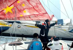 Guo Chuan - first Chinese solo non-stop circumnavigator - arrives home in Qingdao photo copyright Xinhua - China Daily taken at  and featuring the  class