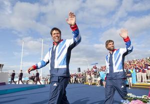Iain Percy (right) and Andrew Simpson (GBR), acknowledge the crowd at the medal ceremony for the Men’s Keelboat (Star) event in The London 2012 Olympic Sailing Competition. photo copyright onEdition http://www.onEdition.com taken at  and featuring the  class