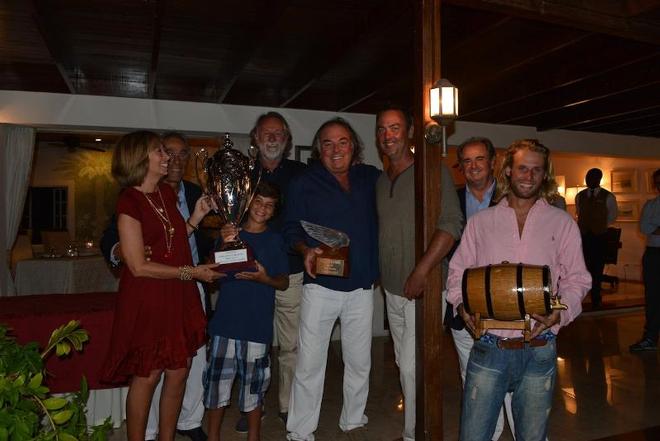 Left to right: Susanna and Enzos Addari, owners of The Inn at English Harbour, Rocco Falcone (son of Carlo) holds The Inn Challenge Trophy, Mauro Pellaschier, skipper of the ’83 America’s Cup boat Azzurra, Carlo Falcone holds the the exquisite Lalique Victoire figurehead, a keepsake for the first edition of the regatta, Mat Barker owner of The Blue Peter, Gianluca ’Lillo’ Mazzetti, Robbie Fabre owner of Vagabundo II with the barrel of English Harbour Antigua Rum, courtesy of Premier Beverages  - © J Rainey