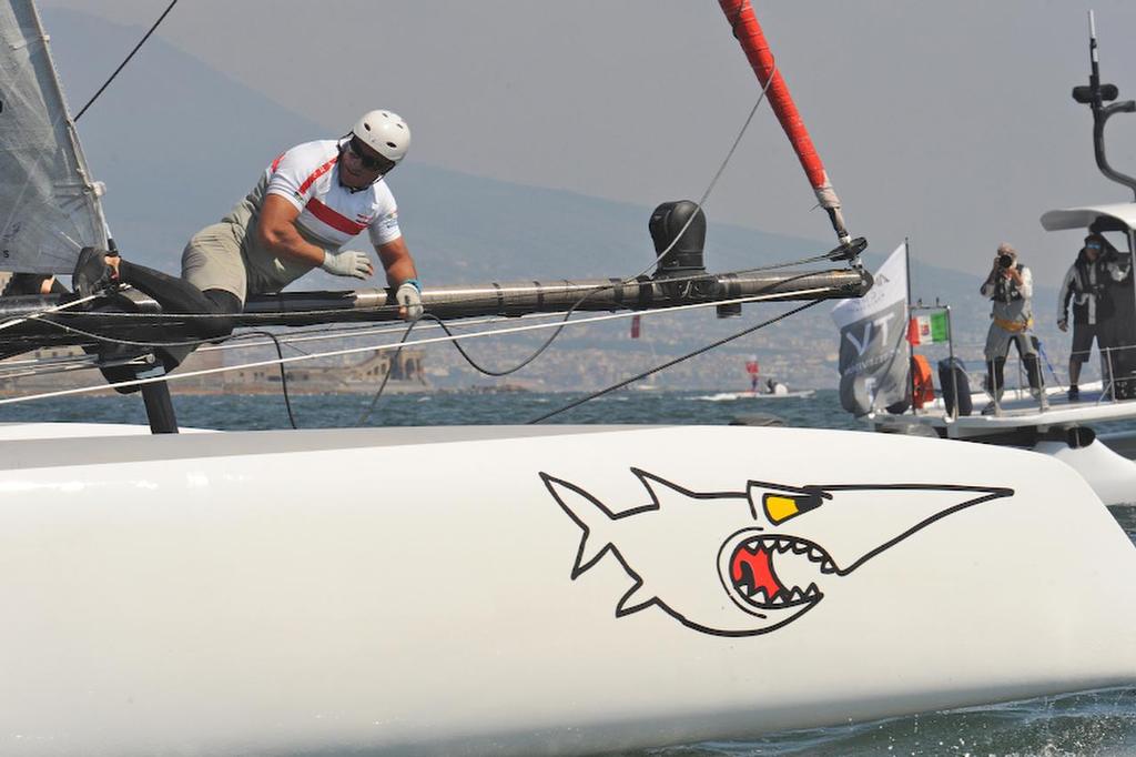 Manuel Modena, Float, for Luna Rossa swordfish, checks for damage after an unusual day on the race course at the ACWS April 19, 2013 in Naples Italy. ©  SW