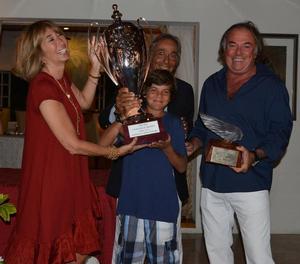 Victory for Mariella. Susanna and Enzo Addari, owners of The Inn at English Harbour present young Rocco Falcone with The Inn Challenge Trophy and Carlo Falcone holds the exquisite Lalique Victoire figurehead keepsake for winning the first edition of the regatta in Antigua - The inn challenge trophy photo copyright J Rainey taken at  and featuring the  class