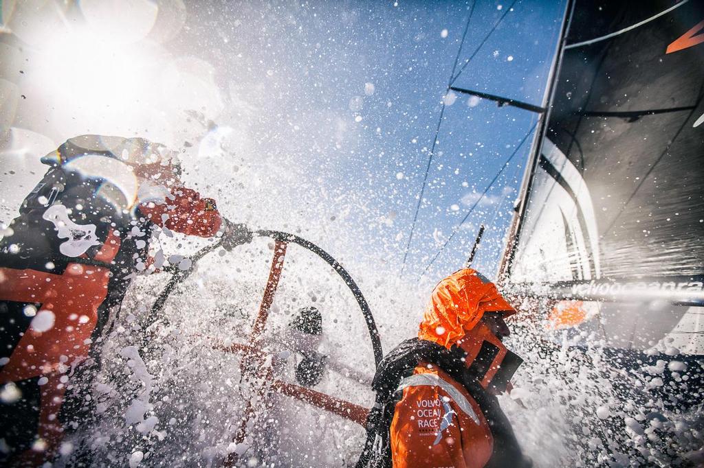 March 28, 2015. Leg 5 to Itajai onboard Team Alvimedica. Day 10. A wild day of short-gybing down the ice limit with 5 of the 6 boats in the fleet within sight of each other, trading places all the time. Alberto Bolzan blasts through a wave from the wheel, while Will Oxley nonchalantly stands in it's path--perhaps unaware of the incoming torrent. photo copyright  Amory Ross / Team Alvimedica taken at  and featuring the  class