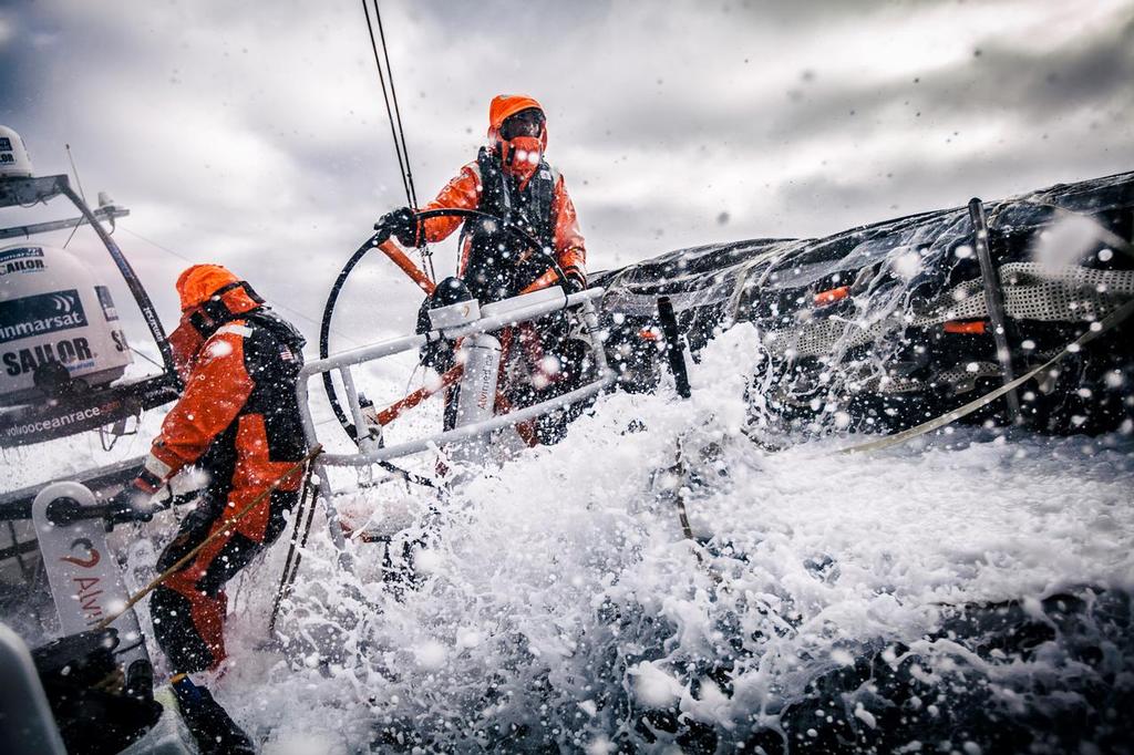 Team Alvimedica -  Stu Bannatyne helping in rough and windy conditions as the Low Pressure system approaches from the west, while Nick Dana stands by on the mainsail trim.  ©  Amory Ross / Team Alvimedica