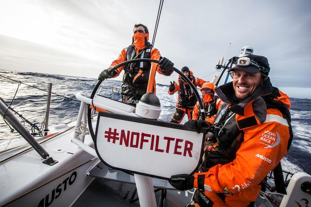 Team Alvimedica - Dave Swete holding a #nofilter sign with the rest of Alvimedica's on-deck crew supporting the good cause. ÔWaves for WaterÕ is using the popular #nofilter hashtag to bring clean water to the underserved. For every #nofilter post they are contributing one gallon of clean water -- to date, 115 mill photo copyright  Amory Ross / Team Alvimedica taken at  and featuring the  class