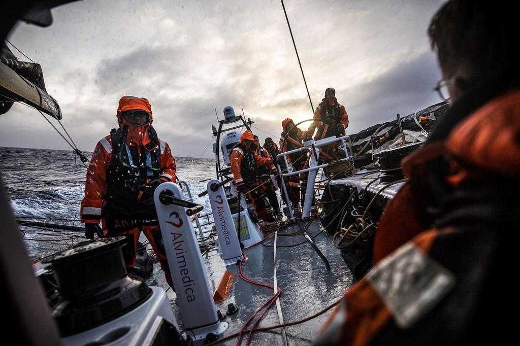 March 28, 2015. Leg 5 to Itajai onboard Team Alvimedica. Day 10. A wild day of short-gybing down the ice limit with 5 of the 6 boats in the fleet within sight of each other, trading places all the time. Will Oxley communicates with the on-deck crew from the hatch about the timing of the next gybe and a potential sail change before darkness. photo copyright  Amory Ross / Team Alvimedica taken at  and featuring the  class