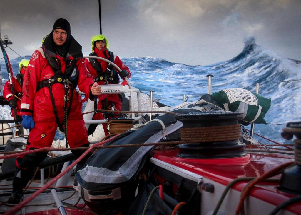 March 23, 2015. Leg 5 to Itajai onboard Dongfeng Race Team. Day 5. Martin Stromberg, Eric Peron and Liu Xue 'Black' on watch with Southern Ocean waves in the background. © Yann Riou / Dongfeng Race Team