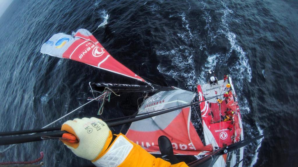 March 31, 2015. Leg 5 onboard Dongfeng Race Team. Kevin Escoffier cuts the broken part off the mast as the team enters the Beagle channel on its way to Ushuaia. © Yann Riou / Dongfeng Race Team