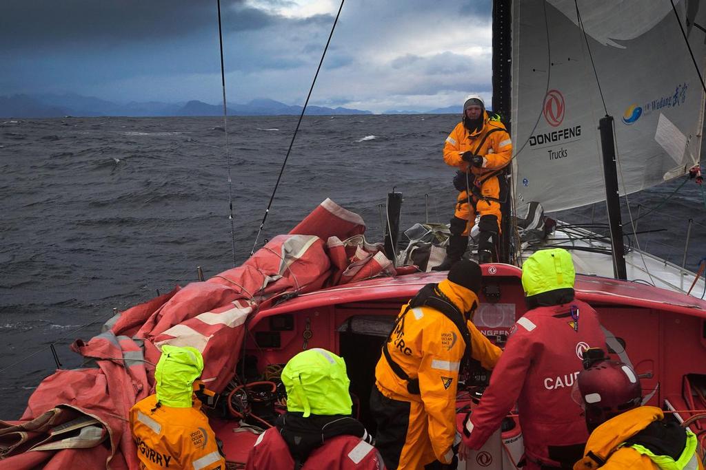 March 31, 2015. Leg 5 onboard Dongfeng Race Team. Kevin Escoffier getting ready to go up the mast to cut the broken piece as the team enters the Beagle channel on its way to Ushuaia. © Yann Riou / Dongfeng Race Team