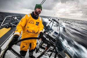 March 20,2015. Leg 5 to Itajai onboard Abu Dhabi Ocean Racing. Day 02. Ian Walker steers Azzam into the cold of the Southern Ocean. photo copyright Matt Knighton/Abu Dhabi Ocean Racing taken at  and featuring the  class