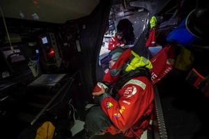 Onboard Dongfeng Race Team - Kevin Escoffier and Jiru Yang 'Wolf' grab a quick lunch between two gybes - Leg five to Itajai -  Volvo Ocean Race 2015 photo copyright Yann Riou / Dongfeng Race Team taken at  and featuring the  class