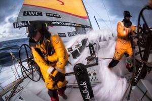 Onboard Abu Dhabi Ocean Racing - Luke Parko Parkinson turns away quick as another wave envelops the cockpit of Azzam after sunset in the Southern Ocean - Leg five to Itajai -  Volvo Ocean Race 2015 photo copyright Matt Knighton/Abu Dhabi Ocean Racing taken at  and featuring the  class
