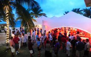 Participants enjoy the BVI Sailing Festival welcome party in the Race Village on the beach at Nanny Cay - BVI Spring Regatta and Sailing Festival photo copyright Todd VanSickle / BVI Spring Regatta http://www.bvispringregatta.org taken at  and featuring the  class