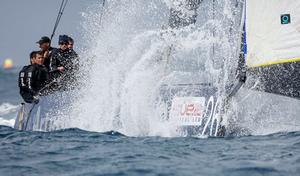 Artemis Racing plows through a giant wave downwind photo copyright MartinezStudio.es taken at  and featuring the  class