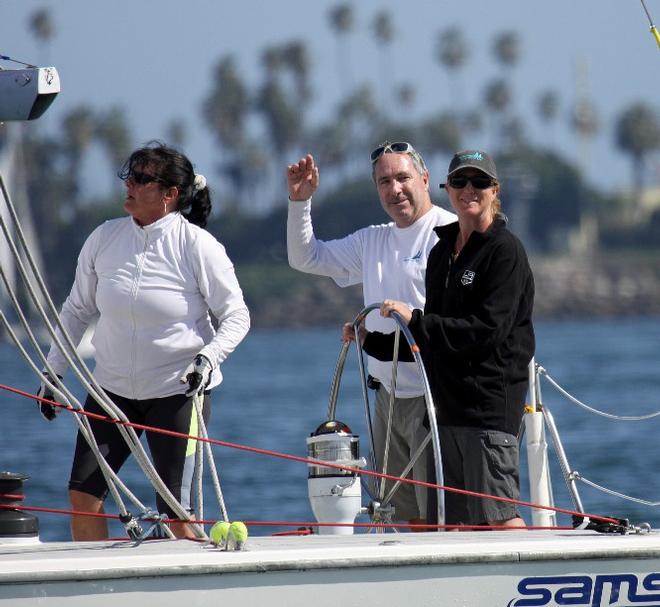 Wendy Corzine (at helm) credits her team and tactician Randy Smith (waving) with getting her an impressive third-place finish - 2015 Mayor’s Cup © Long Beach Yacht Club http://www.lbyc.org