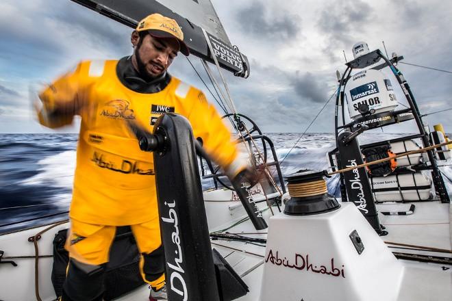 Leg six Newport onboard Abu Dhabi Ocean Racing. Day three. Adil Khalid mans the pumps while trimming the main sail in the Atlantic Ocean. - Volvo Ocean Race 2015 © Matt Knighton/Abu Dhabi Ocean Racing