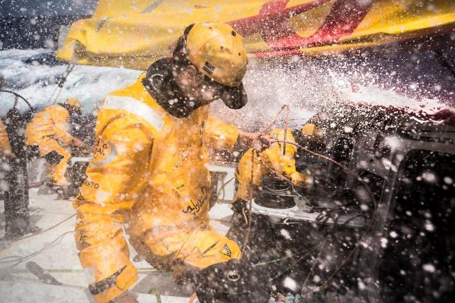Leg six to Newport onboard Abu Dhabi Ocean Racing. Day 10. Daryl Wislang and Adil Khalid take on the firehose while putting in a reef in the Atlantic Ocean. - Volvo Ocean Race 2015 © Matt Knighton/Abu Dhabi Ocean Racing