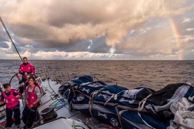 April 23,2015. Leg 6 to Newport onboard Team SCA. Day 4. Sam Davies helms during a tack with Abu Dhabi Ocean Racing sailing into a rainbow.  © Corinna Halloran / Team SCA
